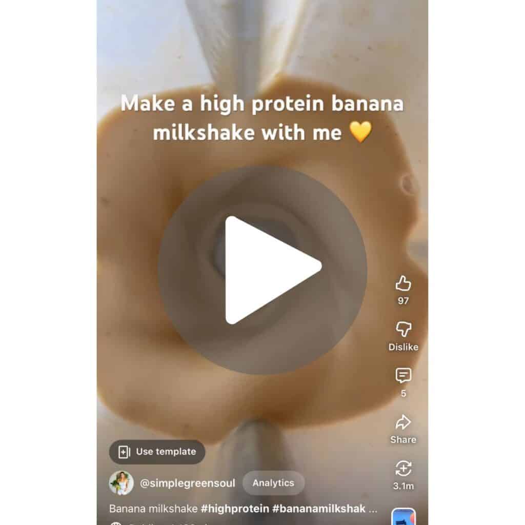 A close-up video screenshot showcasing the soft-serve texture of a 2-ingredient frozen banana smoothie, with a link to watch the minimalist tutorial on YouTube Shorts.