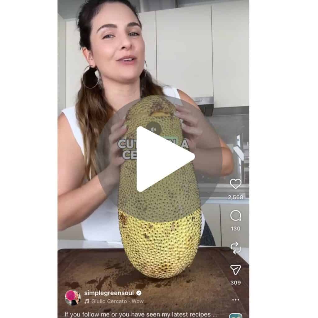 A screenshot of a viral IG video of girl showing how to cut open a cempedak fruit