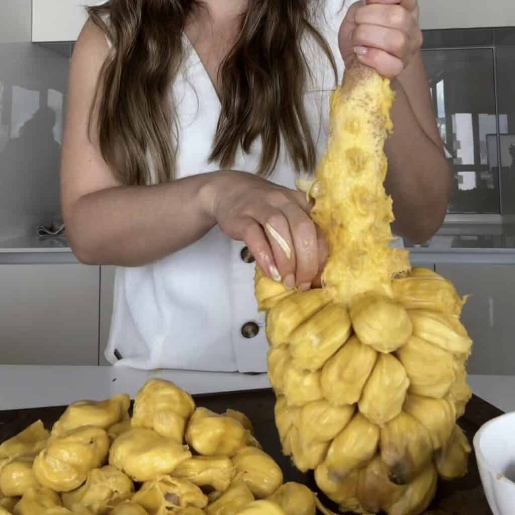 australian girl living in malaysia showing how to cut open a cempedak