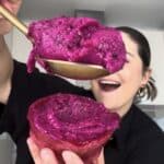 Easy dragon fruit sorbet recipe scooped into a fresh dragon fruit shell made without an ice cream maker