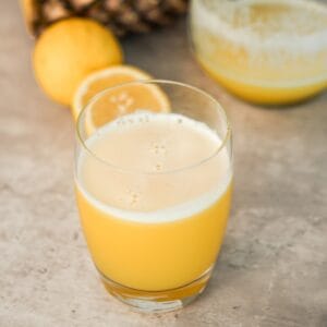 Fresh homemade pineapple juice in a glass made with this easy pineapple juice recipe without a juicer