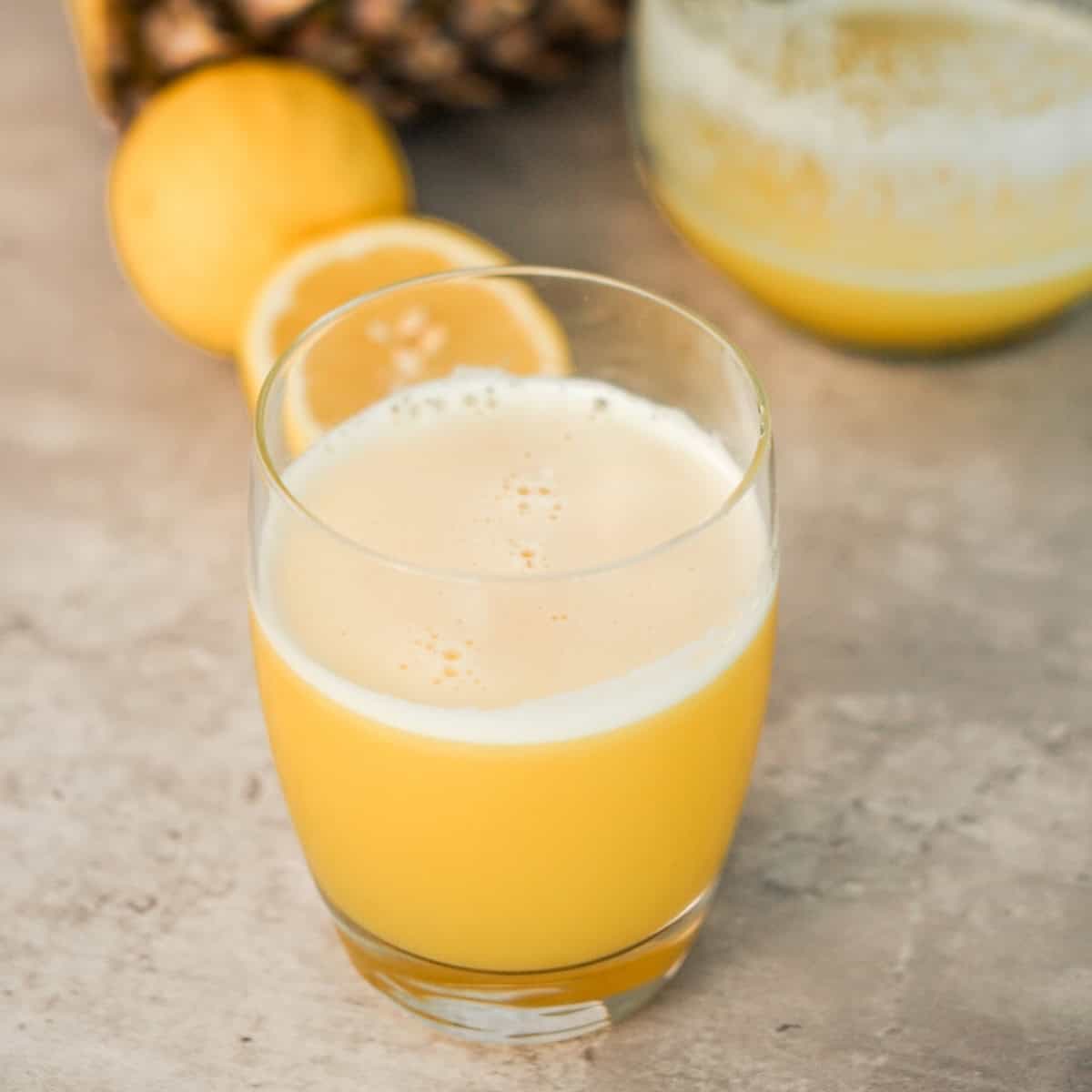 Fresh homemade pineapple juice in a glass made with this easy pineapple juice recipe without a juicer