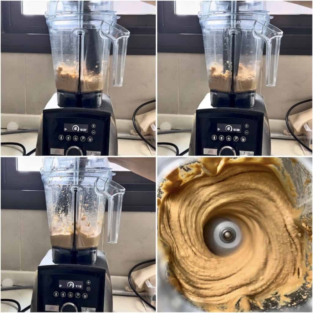 Homemade peanut butter blending in a Vitamix as the peanuts transform from a thick paste into a smooth, creamy consistency.